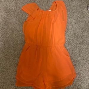 Selling a cute orange romper from Copper Key size girls medium. Very comfortable